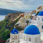 Blue domed church and houses in Oia